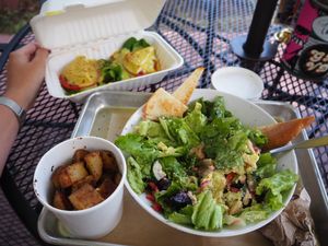 Greek salad, homemade fries and special offers benedict “egg”. at Golden Dinosaurs in Gulfport