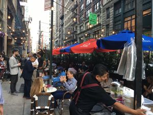 Outdoor seating--fun bar culture, ideally suited for relaxing drinks (but less suited for those seeking vegan meals) at Oscar Wilde in New York City