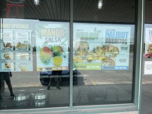 Store Sign advertising Thursday specials and Vegan Cheeze and Burrito Sauce  at Burrito Boyz in Waterloo