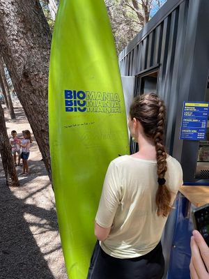 Writing happy messages on our Surfboard at BioMania Street Food in Bol
