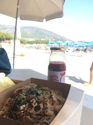 Veggie tofu stir fry and a cold-pressed cherry juice  at BioMania Street Food in Bol