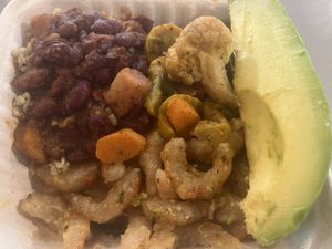 Vegan “shrimp”, rice, beans, veggies and avocado at the cafeteria   at Freshmart Carolina in Carolina