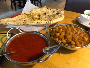 Tomato soup (cooked with my old Indian spices and garlic) Chana Masala ( fresh vegetables with Indian spices) and Garlic Naan. at Taste of India in Reno