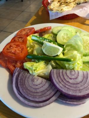 Indian salad (sliced tomatoes, cucumbers, onions, hot peppers with lemon)  at Taste of India in Reno