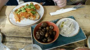 Sourdough with kimchi + avocado , mushrooms and black chickpea hummus sides   at Luca's Kitchen and Bakery  in South East London