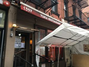 Front entrance (with outdoor seating) at Yuka in New York City