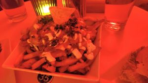 Poutine (sorry red lights) at Neue Republik Reger in Berlin