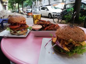 Crispy tempeh burger, fries and cheezy burger at Neue Republik Reger in Berlin