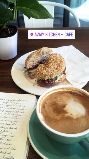 Bagel sandwich and flat white  at Away Kitchen + Cafe - Queen St in Toronto