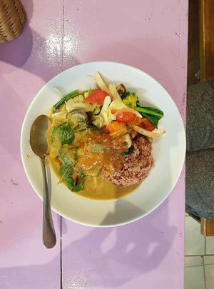 Green curry with rice and peanut sauce at May Kaidee in Bangkok