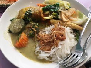 Green curry, rice noodles with peanut sauce at May Kaidee in Bangkok