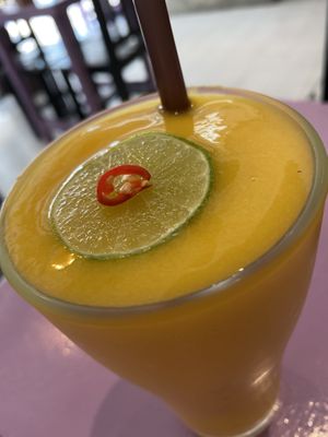 May’s famous zinger (mango, pineapple, lime, ginger, orange, chili)  at May Kaidee in Bangkok