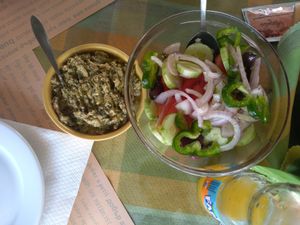 Traditional creamy parsley salad and Greek salad without the feta cheese. at To Mikraki in Syros