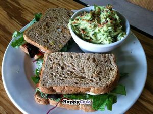 TLT- Tempeh, lettuce, and tomato on cracked wheat with a side of zucchini salad with olive oil, lemon juice, and cashew dressing! at Papa G's Vegan Organic Deli in Portland