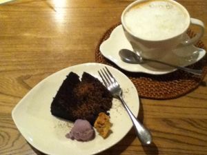 Chocolate cake, ice cream and cappuchino. Absolutely delicious! The cake is perfect and they have a lot of different vegan ice cream flavours. at Aoi Sora Organic Cafe in Sapporo