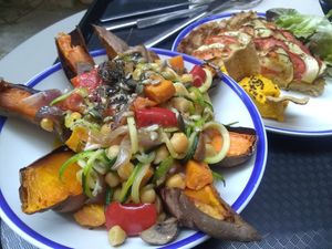 Stuffed sweet potatoes, and quiche with homemade spread on the side at Curcuma Green Food in Burgos