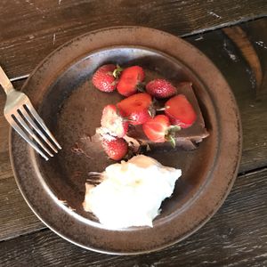 Fudge cake with whipped cream and strawberries  at Mirells in Visby