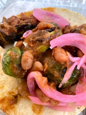 Brussel sprout taco with pinto beans and pickled onion! at Taco Dirty in Tampa
