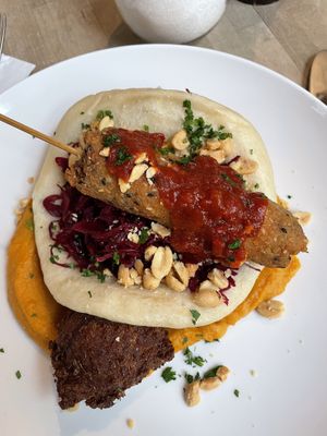 Millet satay skewer, bao bun, sweet potato peanut puree, red cabbage and more  at Du Nord in Bern