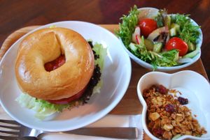 Vegetarian bagels sandwich set (hummus bagel sandwich, salad,  and yogurt with granola). Can swap yogurt with tofu/almond milk for a vegan option. at Storyhouse Cafe & Bar in Matsumoto