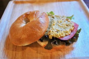 Hummus bagel sandwich. Bagels and hummus made in the cafe! at Storyhouse Cafe & Bar in Matsumoto