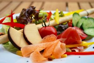 Salads change wit the seasons. Here's a fresh garden salad with biscuit and cheese! at Storyhouse Cafe & Bar in Matsumoto