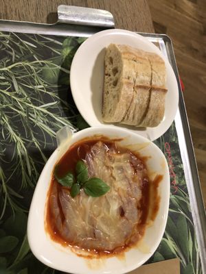 Vegetarian tomato soup with bread  at Vapiano - Walfischgasse in Vienna