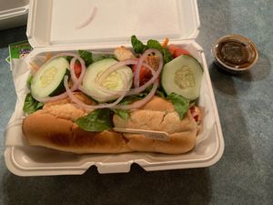 Chick’n parm sandwich with side salad at Turnpike Cafe in Canton