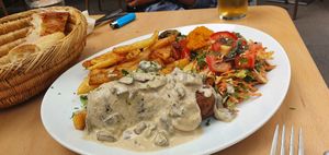 "Andouille de pleurotes" with mushroom sauce, fries and salad at brEAThe Restaurant - Pigalle in Paris