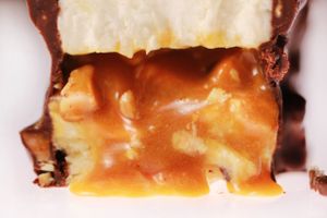 Frozen « snickers ». Vanilla cream, caramel and roasted peanuts core, chocolate and peanuts crumbs coated at brEAThe Restaurant - Pigalle in Paris