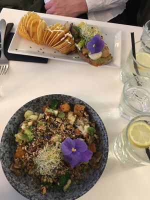 Sautéed small spelt with brocoli, cauliflower, apple & walnut caramelized tofu.

Green pesto tartine with candied lemon, asparagus, spring onions, mushroom and spiral fried potato at brEAThe Restaurant - Pigalle in Paris