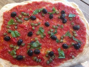 Our Pomodoro Pizza, Olives, Capers, Fresh Chillis, Tomato Sauce and Fresh Basil at Flour Power Pizza Parlour in Truro