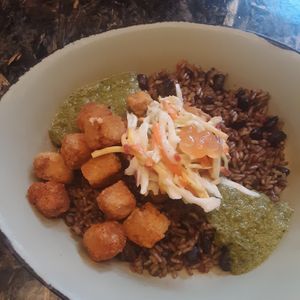 Chili-Spiced Crispy Fried Tofu Bowl topped w/ Crunchy Vegetable Slaw & Boba Balls w/ Rice & Beans base & Charred Green Onion Vinaigrette at Walt Disney World - Satu'li Canteen in Lake Buena Vista