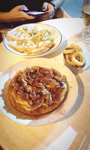 Shiitake octopus on potatoes, deep fried squid, hummus at Sa Capca in Blanes