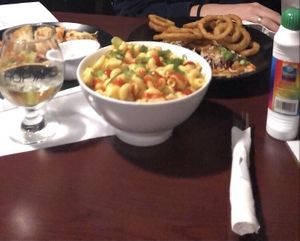 vegan Mac & cheese (center), garlic fingers (left) and flatbread with onion rings (right) at Hopyard Beer Bar in Halifax