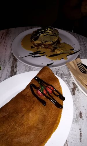 Pancakes with tahini, chocolate and banana, crepe with dark chocolate and strawberries at Hari's Creperie in Crete