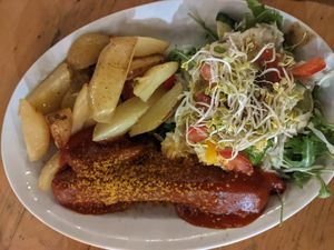 Vegan Curry Sausage with potato wedges and kraut salad (13,50€) - 4/5 at Schleusenkrug in Berlin