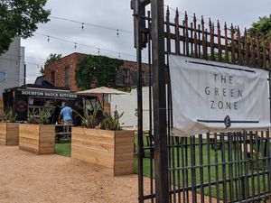 Spacious outdoor picnic table seating in g The Green Zone at Houston Sauce Co in Houston