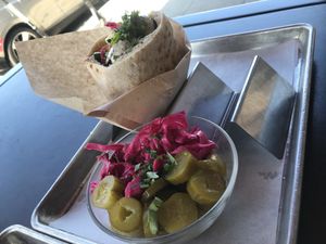 Pickles and falafel pita sandwich at Hasiba in Los Angeles