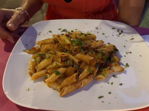 Penne with olives and tomatoes (vegan)   at Ristoro Dantesca in Pisa