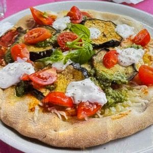 “Primavera”: cherry tomatoes, vegan cheese, eggplants, pesto, fresh basil at Ristoro Dantesca in Pisa