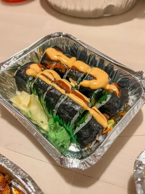 Vegan roll- Spinach, carrots, mushrooms, oshinko and zucchini topped with sriracha & v spicy mayo at Kogi Bar & Grill in Plymouth