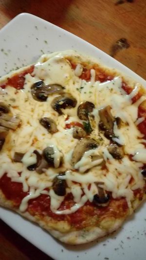 A vegan pizza with vegan cheese and mushrooms. It is great! at La Caffetteria in Valparaiso