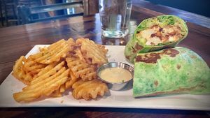 BUFFALO FETA WRAP cauliflower, feta, cucumber, carrot, o'cado aïoli w/ waffle fries.   at O'cado in Sherman Oaks