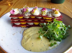 Beet millefeuille salad with passionfruit and herb foam at Orteá - Vegan Collective in Lisbon