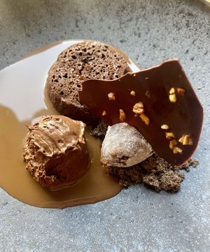 Petit gateau, chocolate mousse, brownie ice cream served with coffee and chocolate cream   at Orteá - Vegan Collective in Lisbon