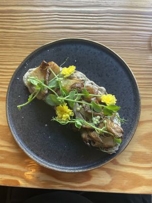 Bruschetta with cream cheese, pears, mushrooms and cilantro pearls  at Orteá - Vegan Collective in Lisbon