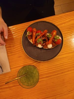 Toast with cheese, tomato, and truffle and basil cocktail at Orteá - Vegan Collective in Lisbon