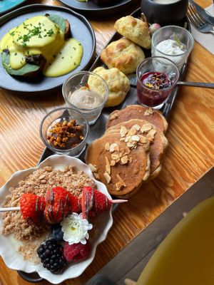 Brunch - Pancakes, yogurt with granola and fruit and several paté, cheeses for the bread at Orteá - Vegan Collective in Lisbon