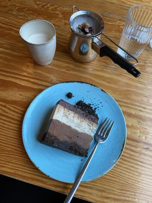 Coconut and chocolate cake, chai latte  at Orteá - Vegan Collective in Lisbon